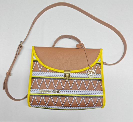 Earthsong style 001 brown leather shoulder handbag with tribal-print front, yellow binding, curved flap and gold-tone clasp.