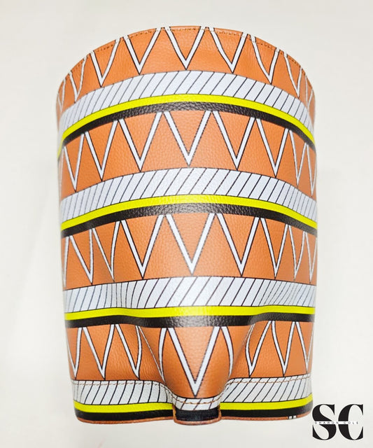 Earthsong Nefertiti genuine leather statement hat with tall sculptural crown and brown, white, black and yellow tribal print.
